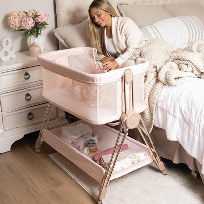 Baby Bedside Sleeper - Bassinet & Bedside Crib with Height Adjustment & Wheels - Can Be Placed Next to Bed - Attaches to Parents Bed - Easy to Fold & Carry Baby Bed for Girls (Pink)